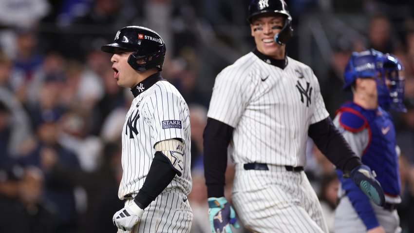 NEW YORK, NEW YORK – OCTOBER 29:  Aaron Judge #99of the New York Yankees congratulates Anthony Volpe #11 at home plate after Volpe hit a grand slam home run during the third inning of Game Four of the 2024 World Series against the Los Angeles Dodgers at Yankee Stadium on October 29, 2024 in the Bronx borough of New York City. (Photo by Sarah Stier/Getty Images)