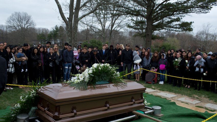 CORAM, NY – APRIL 19: Family and friends say goodbye to Justin Llivicura at his burial in a cemetery on April 19, 2017 in Coram, Long Island, New York.  Justin, a sixteen-year-old high school student, was one of four teenagers murdered in a park in Central Islip in what many suspect to be a gang attack by members of MS-13. (Photo by Andrew Lichtenstein/Corbis via Getty Images)