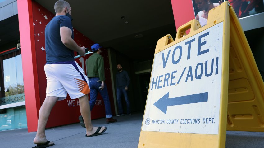 PHOENIX, ARIZONA – NOVEMBER 08: Voters arrive to cast their ballots at the Phoenix Art Museum on November 08, 2022 in Phoenix, Arizona. After months of candidates campaigning, Americans are voting in the midterm elections to decide close races across the nation. (Photo by Kevin Dietsch/Getty Images)