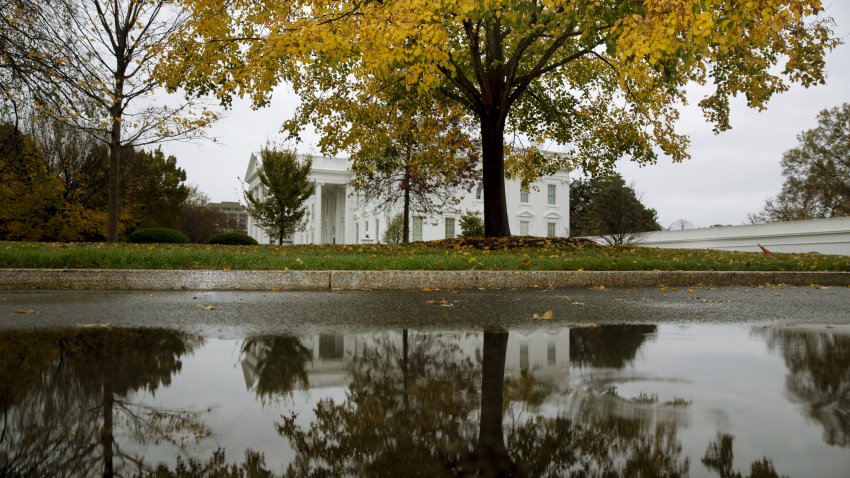 The White House is reflected in a puddle in Washington, D.C., U.S., on Thursday, Nov. 12, 2020. President-elect Biden has stocked his transition team with policy experts, academics and former Obama administration officials, a contrast with the industry-friendly figures President Trump sent into the government upon winning office. Photographer: Michael Reynolds/EPA/Bloomberg via Getty Images