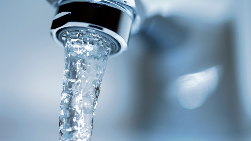 Faucet close-up with running water.