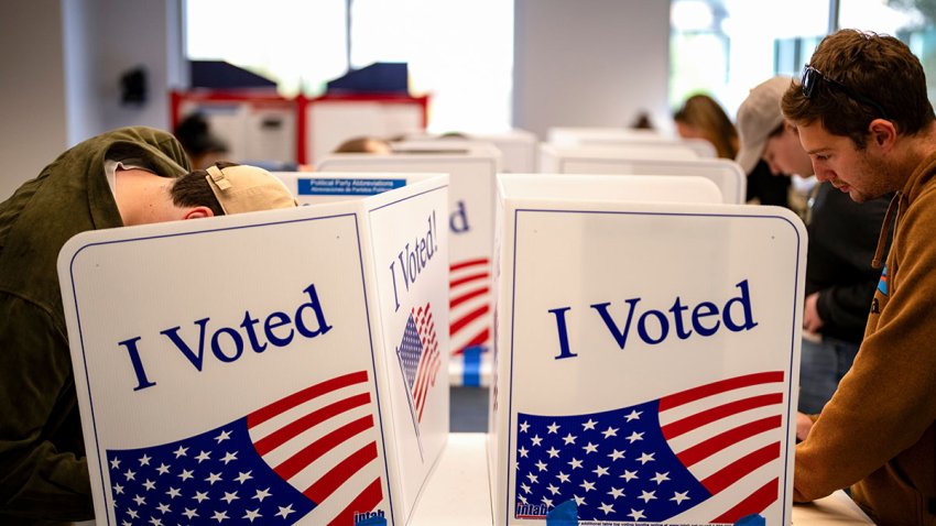 Voters mark their ballots during early voting at a polling location at the Ellen M. Bozeman Government Center in Arlington, Virginia, US, on Saturday, Oct. 26, 2024. A federal judge in Virginia on Friday halted what she concluded was an unlawful, systematic purge of names from the state’s voter rolls ahead of the Nov. 5 presidential election, in a win for the Biden administration. Photographer: Kent Nishimura/Bloomberg via Getty Images