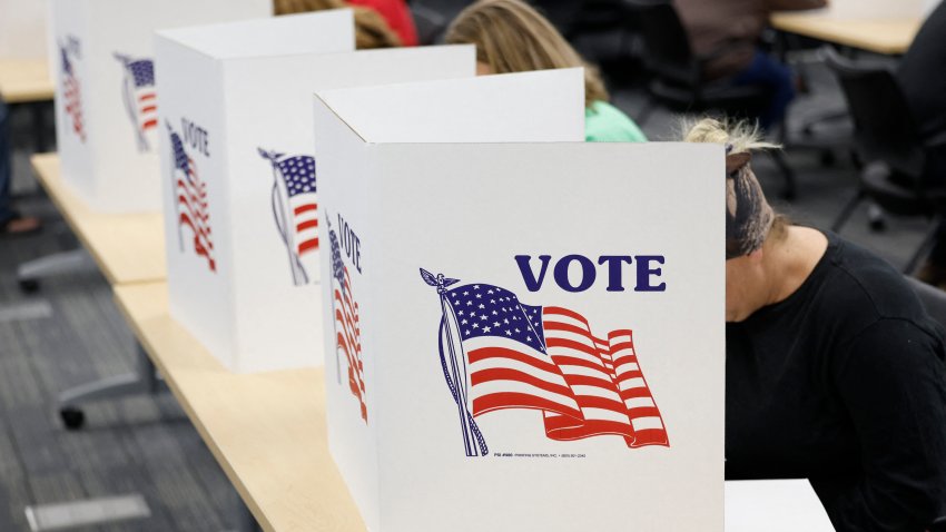 TOPSHOT – People cast their ballots on the last day of early voting for the general election in Michigan at the Livingston Educational Service Agency in Howell, Michigan on November 3, 2024. (Photo by JEFF KOWALSKY / AFP) (Photo by JEFF KOWALSKY/AFP via Getty Images)