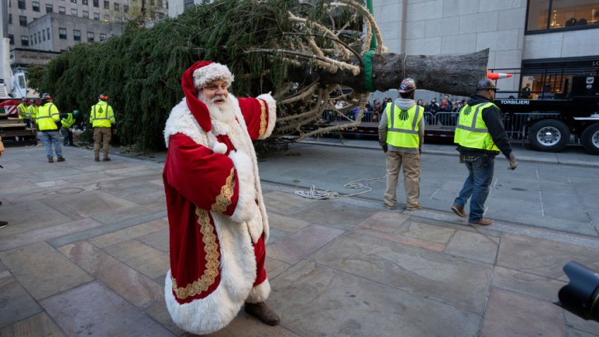 NEW YORK, NEW YORK – NOVEMBER 09: An actor dressed as Santa Claus arrives during the installation of the Rockefeller Center Christmas tree on November 09, 2024 in New York City. (Photo by Craig T Fruchtman/Getty Images)