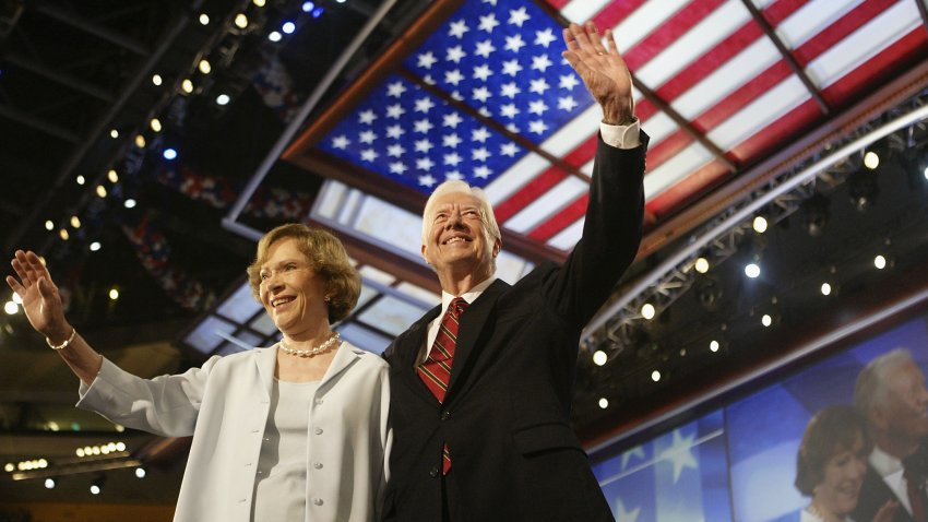 BOSTON, MA – JULY 26:  Former U.S. President Jimmy Carter and his wife Rosalynn wave to the audience during the Democratic National Convention at the FleetCenter July 26, 2004 in Boston, Massachusetts. Democratic presidential candidate U.S. Senator John Kerry (D-MA) is expected to accept his party’s nomination later in the week.  (Photo by Scott Olson/Getty Images)