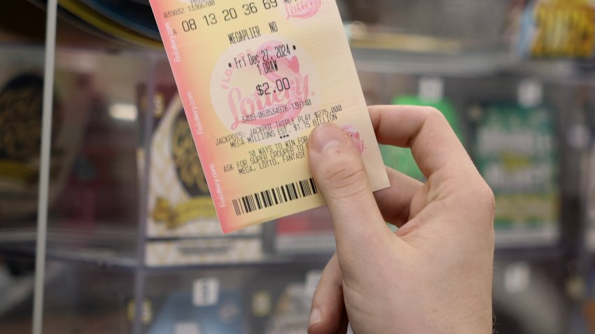 MIAMI, FLORIDA – DECEMBER 26: A customer plays Mega Millions lottery at the Downtown Miami Souvenirs store on December 26, 2024 in Miami, Florida. The Mega Millions jackpot has climbed to $1.15 billion ahead of Friday’s drawing, making it the fifth-largest prize in the game’s history and the largest prize ever offered in the month of December (Photo by Joe Raedle/Getty Images)