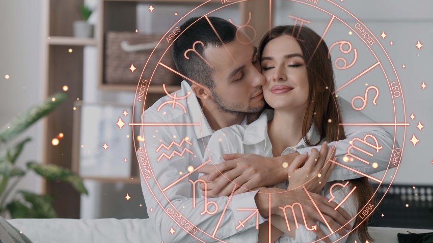 Happy young couple at home. Love compatibility horoscope. Partner matching by date of birth