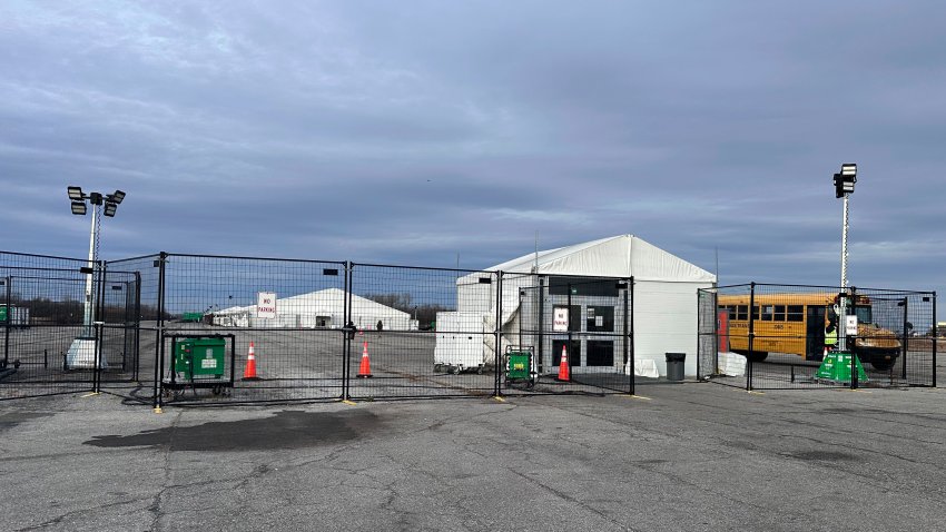 FILE – The gate at the migrant shelter, is closed at Floyd Bennett Field on Wednesday, Dec. 4, 2024 in New York. (AP Photo/Philip Marcelo, File)