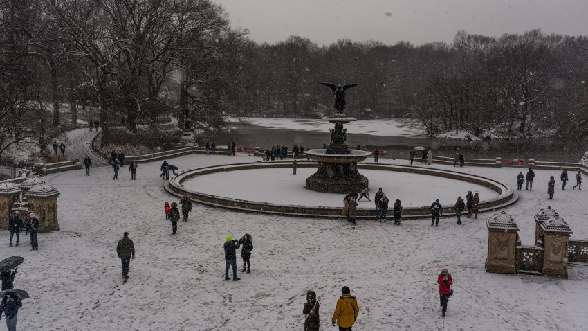 NEW YORK, UNITED STATES – JANUARY 6: People spend time around Bethesda Terrace in Central Park during heavy snowfall in New York, United States, on January 6, 2025. (Photo by Thomas Hengge/Anadolu via Getty Images)