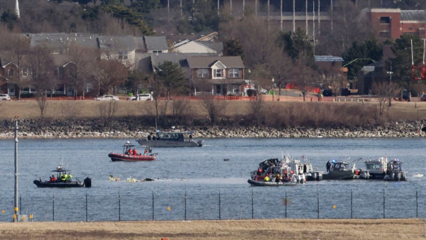 Emergency crews respond to the crash site along the Potomac River after a enger jet collided with a helicopter while landing at Ronald Reagan Washington National Airport (DCA) in Arlington, Virginia, US, on Thursday, Jan. 30, 2025. The collision between an American Airlines Group Inc. regional jet and a military helicopter near Ronald Reagan airport in Washington left no survivors on board the two aircraft, authorities said, making it one of the most deadly US air disasters in decades and an early test for President Donald Trump’s istration in his second week in office. Photographer: Tierney L. Cross/Bloomberg via Getty Images