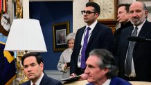 Billionaire Elon Musk (2nd R) looks on as US President Donald Trump meets with Indian Prime Minister Narendra Modi in the Oval Office of the White House in Washington, DC, on February 13, 2025. Modi will try to rekindle his bromance with Donald Trump -- and avoid the US president's wrath on tariffs and immigration -- when they meet at the White House. Trump will be pushing for a "fair" trade deal with India, while the two leaders will also discuss a new defense partnership and military sales during the meeting, senior White House officials said. (Photo by Jim WATSON / AFP) (Photo by JIM WATSON/AFP via Getty Images)
