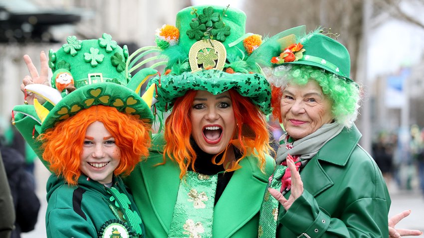 Revellers pose for a photograph during the annual St Patrick’s Day parade in Dublin on March 17, 2025. (Photo by PAUL FAITH / AFP) (Photo by PAUL FAITH/AFP via Getty Images)