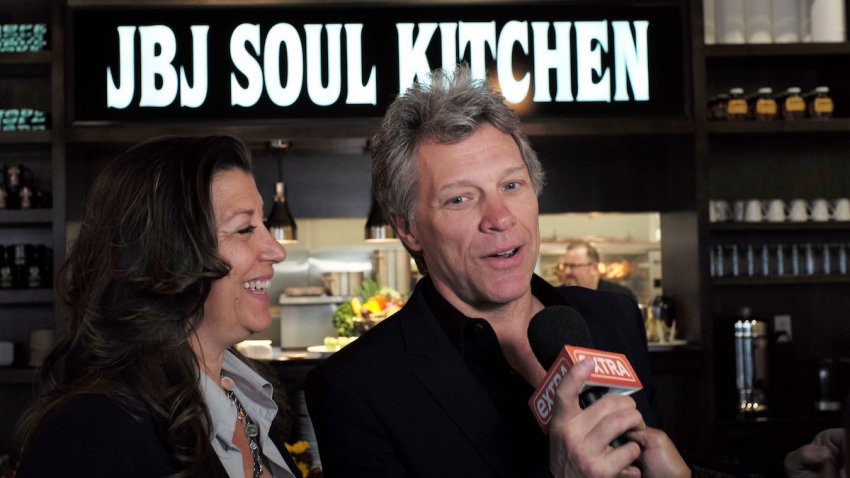 US singer Jon Bon Jovi and his wife Dorothea speak to the media after opening the BEAT (Bringing Everyone All Together) center in Toms River, New Jersey, on May 10, 2016.
The Food Bank of Monmouth and Ocean Counties, Jon Bon Jovi Soul Foundation and Peoples Pantry announced the opening of BEAT, a place where families and individuals can access food, job training and resources to help end the cyclical causes of hunger in Ocean county.