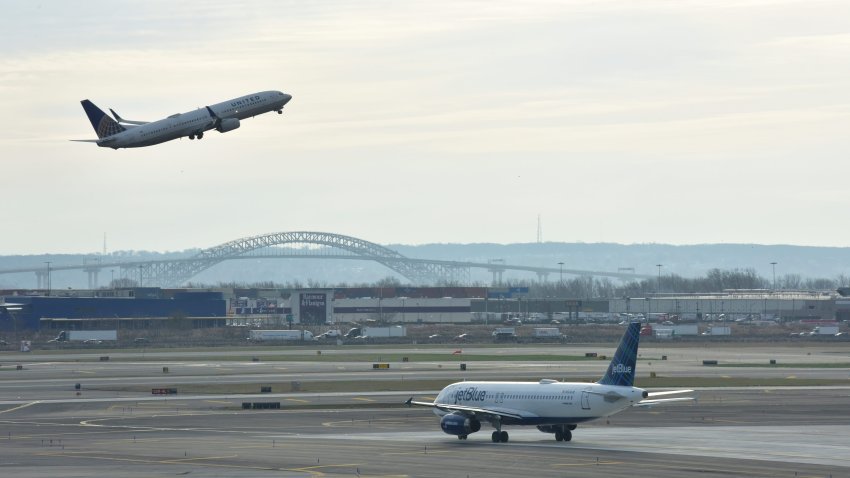 A plane takes off from Newark Liberty Airport on the day before Thanksgiving on Wednesday Nov. 25, 2020.