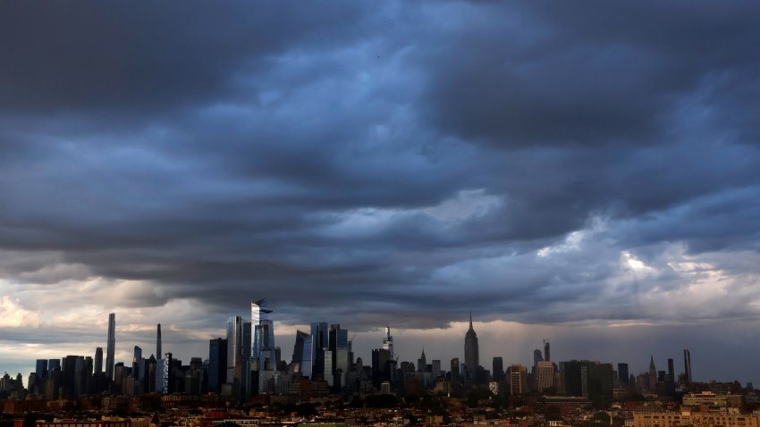 JERSEY CITY, NJ – MAY 23: Rain clouds  over the skyline of midtown Manhattan, Hudson Yards and the Empire State Building as the sun sets in New York City on May 23, 2025, as seen from Jersey City, New Jersey. (Photo by Gary Hershorn/Getty Images)