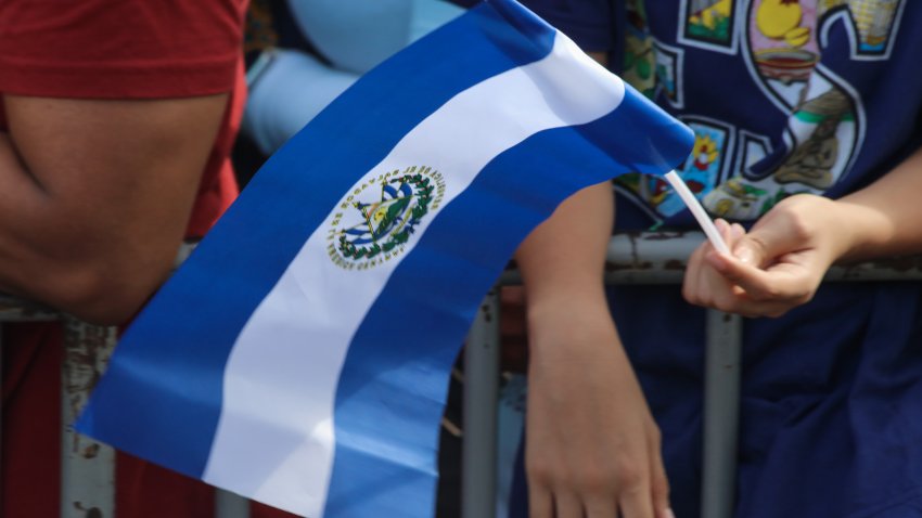 SAN SALVADOR, EL SALVADOR – JUNE 01: A young man carries a Salvadoran flag during the presidential inauguration ceremony of Nayib Bukele at the National Palace in the historic center, in San Salvador, El Salvador on June 01, 2024. The president of El Salvador, Nayib Bukele, was inaugurated by the Salvadoran Congress for a second consecutive term for the period 2024-2029, despite the constitutional prohibition, with broad popular support and complaints about the country’s economic situation, which the The president promised to improve in this new period. (Photo by Alex Pena/Anadolu via Getty Images)