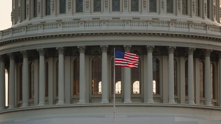 WASHINGTON, DC – JUNE 10: An American flag waves at the U.S. Capitol Building as the sun sets on June 10, 2025 in Washington, DC. (Photo by Kevin Carter/Getty Images)