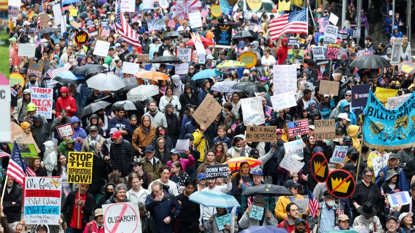 People take part in a “No Kings” protest in New York on June 14, 2025 as US President Donald Trump presides over a military parade in Washington, DC. Trump will preside over a huge military parade in Washington on his 79th birthday, as nationwide protests rejecting his brand of politics underscore deep divisions over his second term. But the threat of thunderstorms in the US capital, and the barrage of missiles raining down in Tel Aviv and Tehran — a conflict in which the American military is assisting — could cast a long shadow over the president’s celebration. Nearly 7,000 troops plus dozens of tanks and helicopters will rumble through Washington in an event officially marking the 250th anniversary of the US army — at a cost of up to $45 million. (Photo by CHARLY TRIBALLEAU / AFP) (Photo by CHARLY TRIBALLEAU/AFP via Getty Images)
