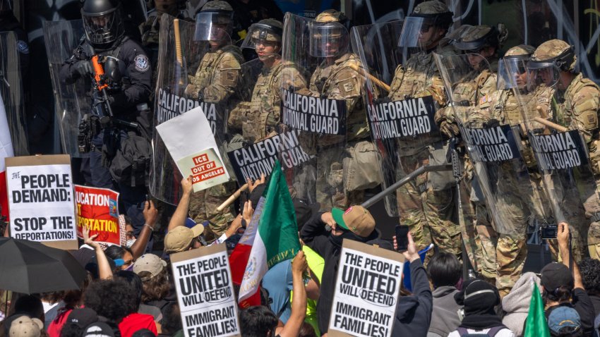 LOS ANGELES, CALIFORNIA – JUNE 09: A police officer holds a nonlethal rifle as protesters confront California National Guard soldiers and police outside of a federal building as protests continue in Los Angeles following three days of clashes with police after a series of immigration raids on June 09, 2025 in Los Angeles, California. Tensions in the city remain high after the Trump istration called in the National Guard against the wishes of city leaders.  (Photo by David McNew/Getty Images)