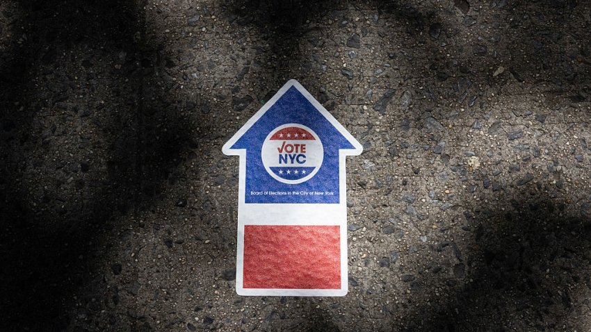 A “Vote NYC” sign points towards a polling station during the New York City mayoral Democratic primary in the Brooklyn borough of New York, US, on Tuesday, June 24, 2025. New Yorkers are heading to the polls Tuesday to choose a Democratic candidate for mayor as a sweltering heat wave engulfs the city, and with tightened security in place after the US unleashed airstrikes on Iran. Photographer: Christian Monterrosa/Bloomberg via Getty Images