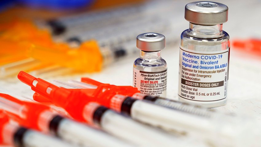 FILE – Pfizer, left, and Moderna bivalent COVID-19 vaccines are readied for use at a clinic, Nov. 17, 2022, in Richmond, Va. The Food and Drug Administration on Friday, June 16, 2023, told COVID-19 vaccine makers to update fall shots to target the latest omicron strain. (AP Photo/Steve Helber, File)