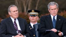 FILE: Outgoing Secretary of Defense Donald Rumsfeld, left, and U.S. President George Bush, right listen to comments made by U.S. Vice President Dick Cheney during a ceremony honoring Rumsfeld at the Pentagon in Arlington, Virginia, Friday, December 15, 2006. Donald Rumsfeld, the defense secretary who became the face of U.S. foreign policy under President George W. Bush while the administrations troop deployments toppled hostile regimes in Afghanistan and Iraq, has died on June 30, 2021.. He was 88 Photographer: Chris Greenberg/Bloomberg via Getty Images