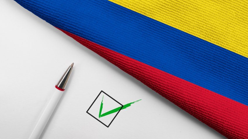 Pencil, Flag of Colombia and check mark on paper sheet