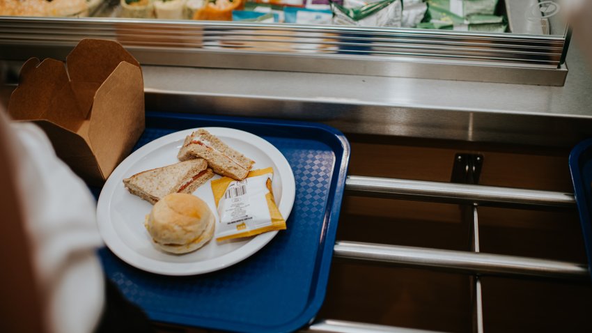 Close-up of high school students trays in a cafeteria in a school.