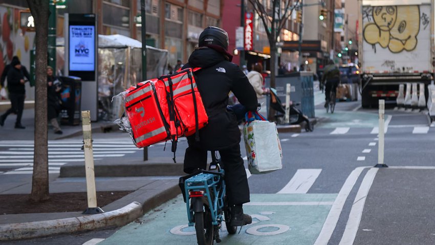 A delivery worker with a DoorDash bag in New York, US, on Thursday, Jan. 15, 2026. The New York Department of Consumer and Worker Protection sent notices to major food-delivery platforms including Uber Eats, DoorDash, Grubhub and Instacart, warning them to comply with new worker protections taking effect later this month. Photographer: Michael Nagle/Bloomberg via Getty Images