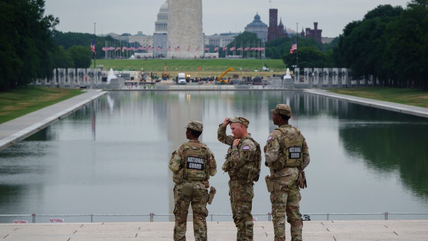 WASHINGTON, DC – JULY 9: Members of the U.S. National Guard stand near the fenced off Lincoln Memorial Reflecting Pool with the Washington Monument in the background on July 9, 2026 in Washington, DC. (Photo by Kevin Carter/Getty Images)