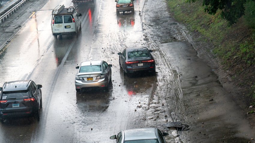 Several cars including this Honda sedan were disabled on the Clearview Expressway from earlier flash flood waters at 48th Avenue as powerful thunderstorms rock New York City on Saturday, July 18, 2026. (Theodore Parisienne/New York Daily News/Tribune News Service via Getty Images)