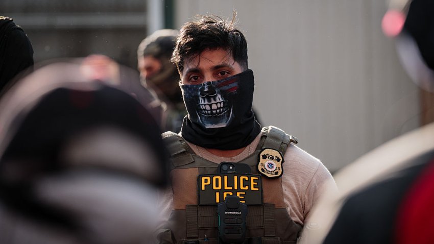 NEWARK, NEW JERSEY – MAY 28: A masked ICE agent stands guard outside of the federal immigration center at Delaney Hall, where ICE is housing detained immigrants, on May 28, 2026 in Newark, New Jersey. The ongoing protests, which became tense over the holiday weekend, come amid reports of a hunger strike by detainees. (Photo by Adam Gray/Getty Images)