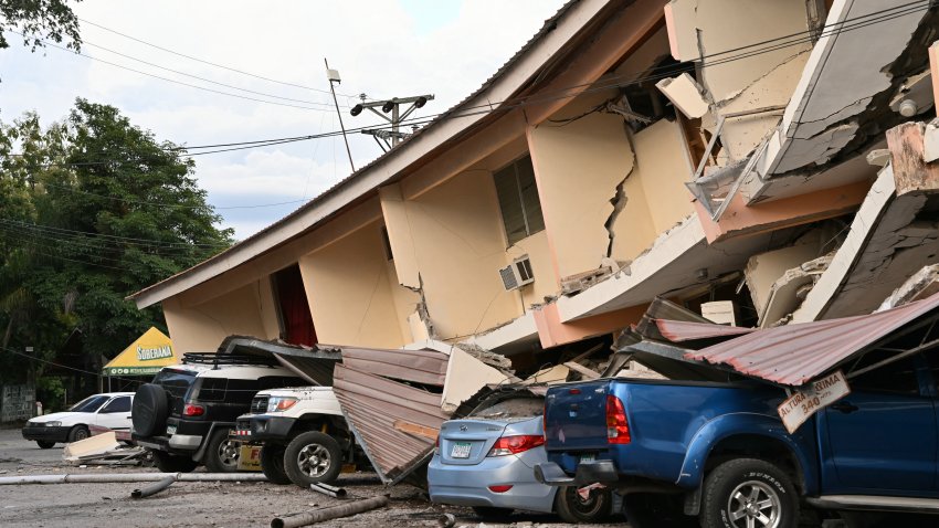 This view shows a collapsed building and damaged cars after a 7.6-magnitude earthquake struck the country, in Penonome, Panama, on October 9, 2026. According to the US Geological Survey (USGS), a magnitude 7.6 earthquake shook Panama sparking panic in the capital, though no casualties or damage have been reported so far. (Photo by MARTIN BERNETTI / AFP via Getty Images)